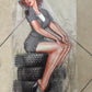 Pin up girl sitting on tires plaque